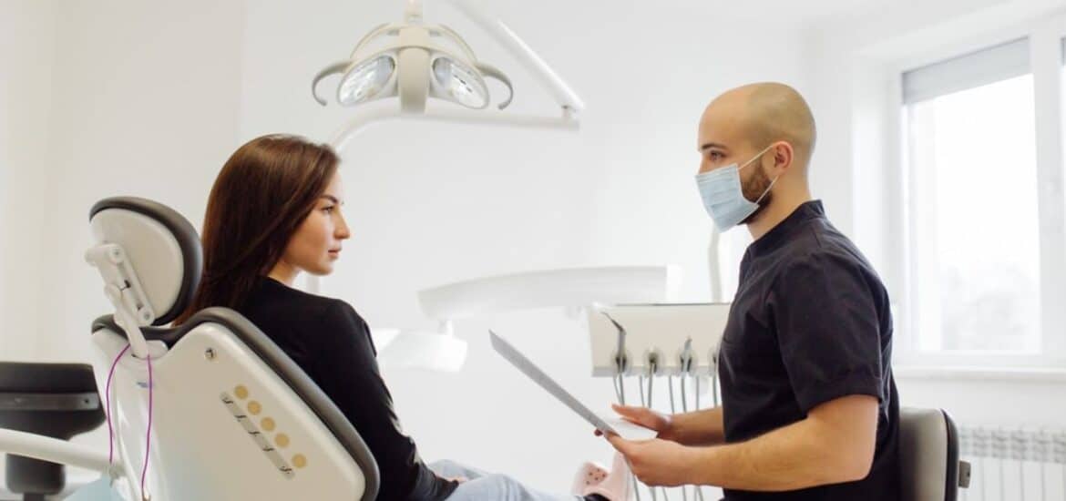A patient consulting a dentist during a dental checkup in Reno, NV.