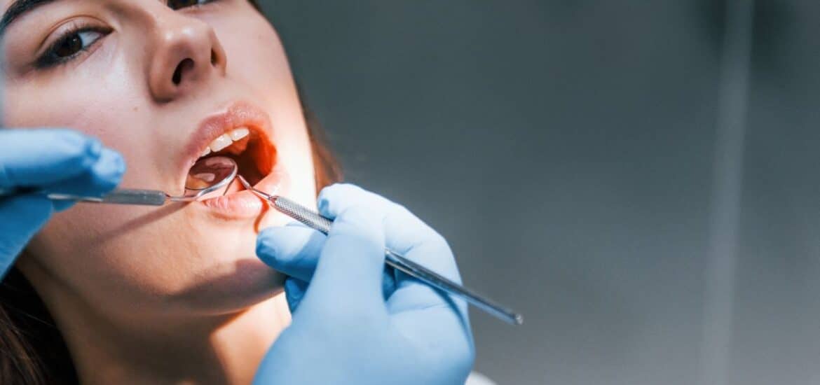 Patient undergoing comprehensive oral care at a modern dental practice.
