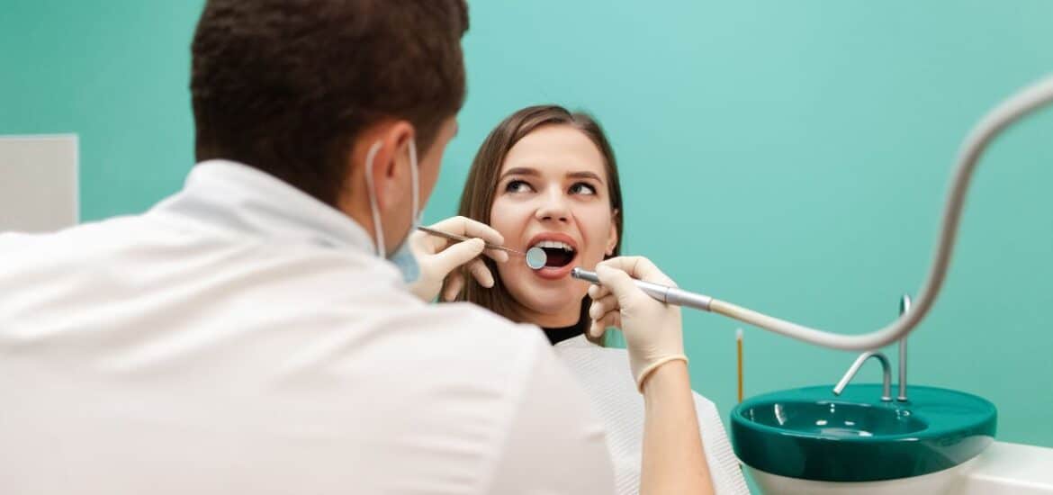 Patient receiving comprehensive dental care during a modern preventive dental examination.