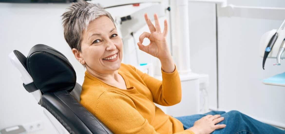 Happy patient showing confidence after a preventive dental visit and smile wellness consultation.